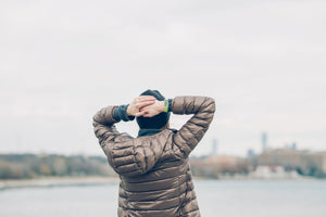 Man in coat thinking about hearing loss audiogram