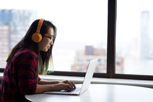 Woman with headphones doing audiogram test