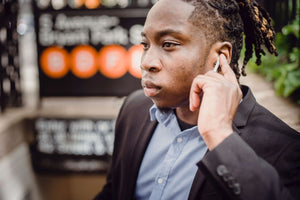 man with muffled hearing in one ear