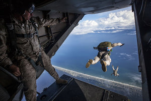 military man jumping out of plane 