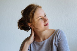 woman looking away showing an ear