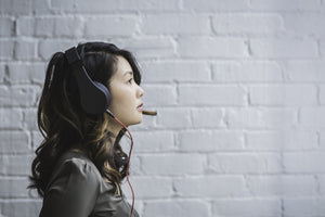 woman with hearing loss wearing headphones